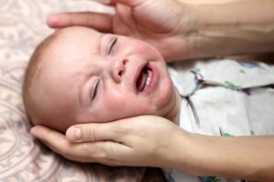Baby hoest in slaap